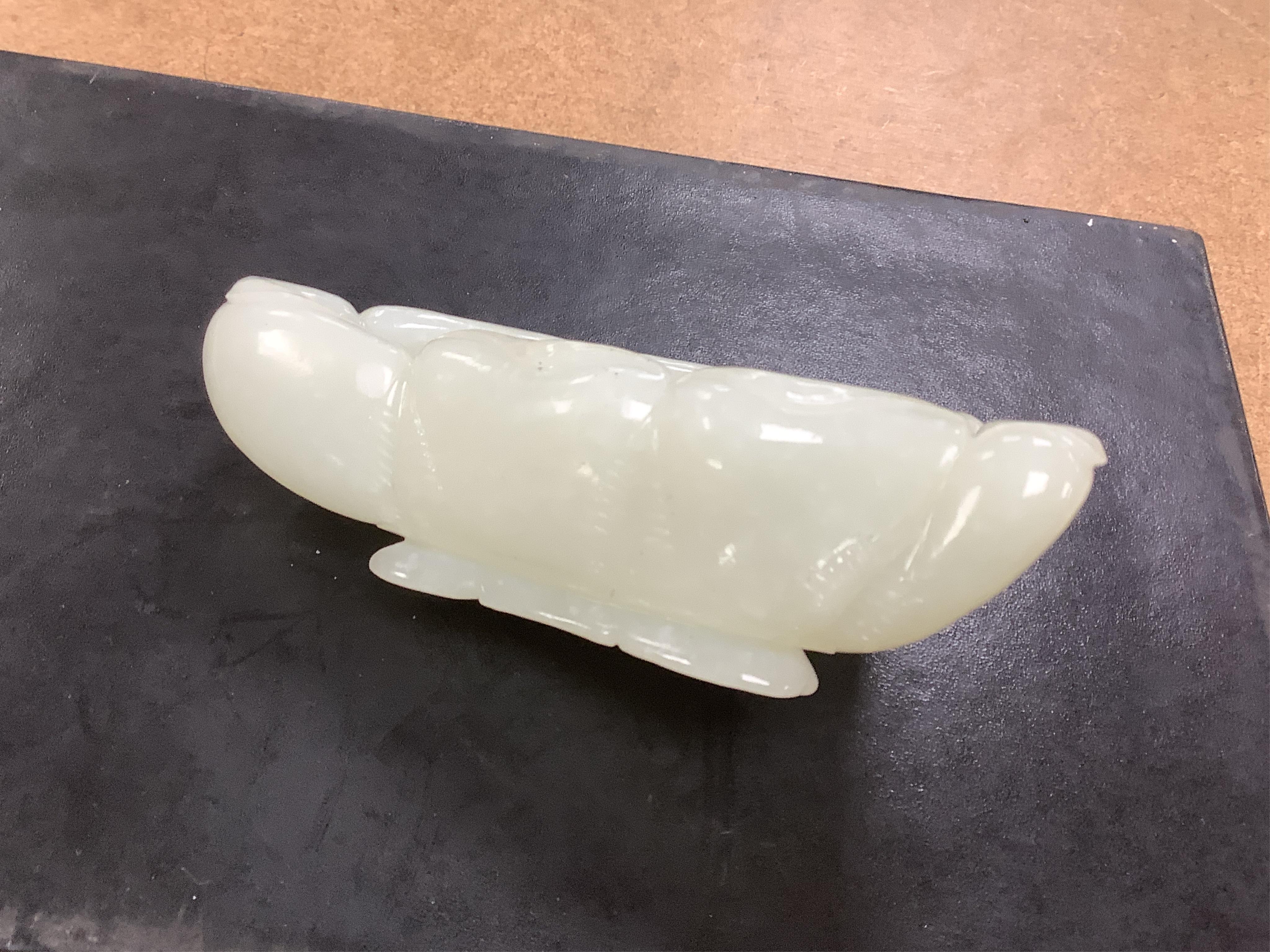 A Chinese jade ‘lotus’ shaped brush washer, 13cm wide. Condition - good